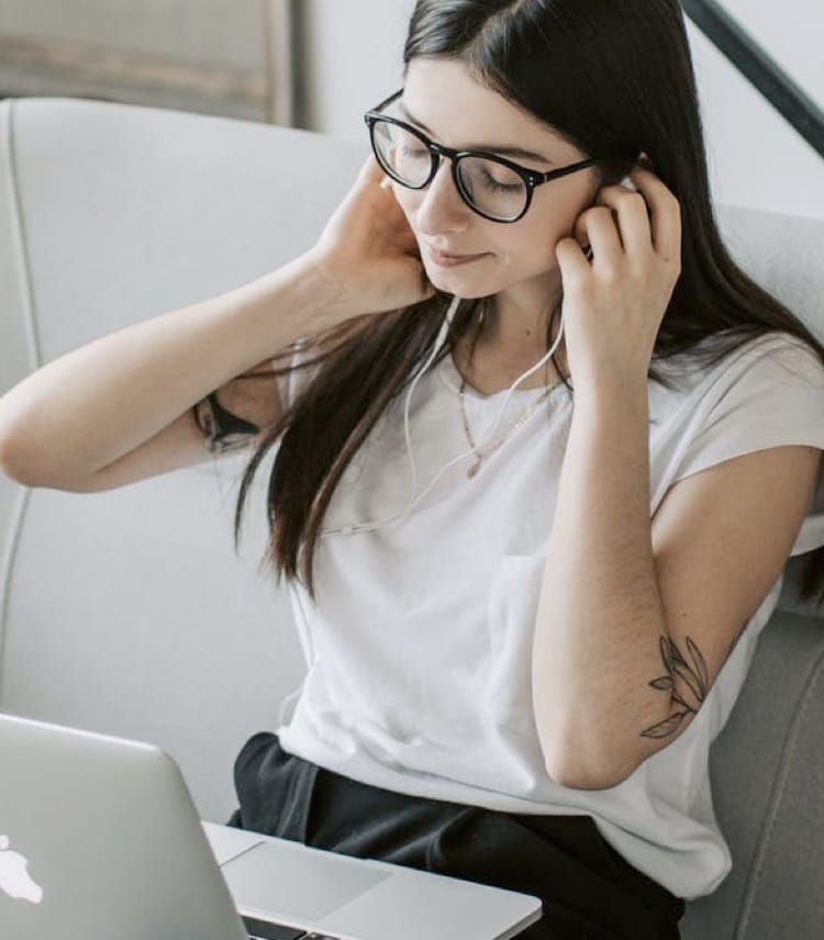 woman on video call wearing earphones